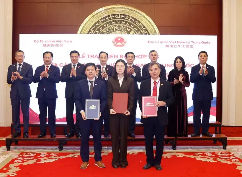 vna-potal-le-trao-bien-ban-ghi-nho-hop-tac-giua-cac-doanh-nghiep-viet-nam-trung-quoc-8701400.jpg.png